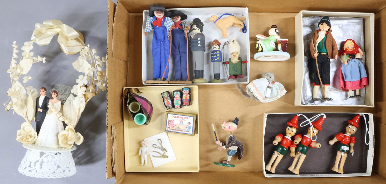 MINIATURES, BAPS/OTHER DOLLS.: LOT. Pair of BAPS Dolls - "Heidi" and the "Grandfather". (3) Wooden Pinocchio dolls (purchased in Florence, Italy). Pair of "Uncle Mose" dolls. Pair of clothespin/type wooden dolls. M & L Trade Mark r