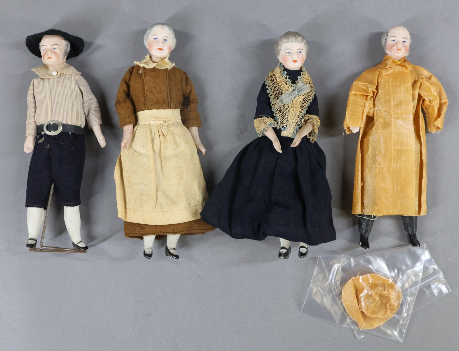 MINIATURES, CHARACTER DOLLS.: LOT of (4) antique GERMAN character/dollhouse dolls. 6", 6", 6 1/4", 6 1/4". (2) Elderly Men, (2) Elderly Women. All of them have bisque heads with painted features and hair. Cloth bodies, bisque lowe
