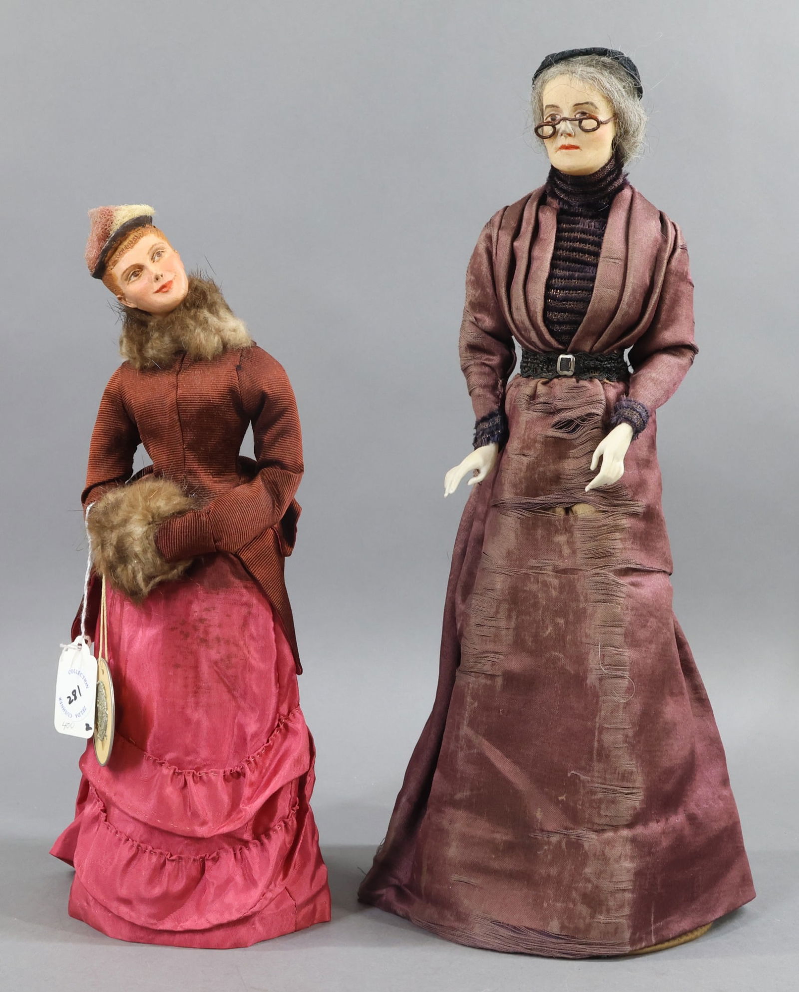 WAX/OTHER DOLLS.: Pair of antique Lady Dolls. Both have painted features and upper torsos are mounted on bases. 15 1/2" Lady with poured wax shoulder head has bisque hands. Lower body is a wire cage. She has a grey moh