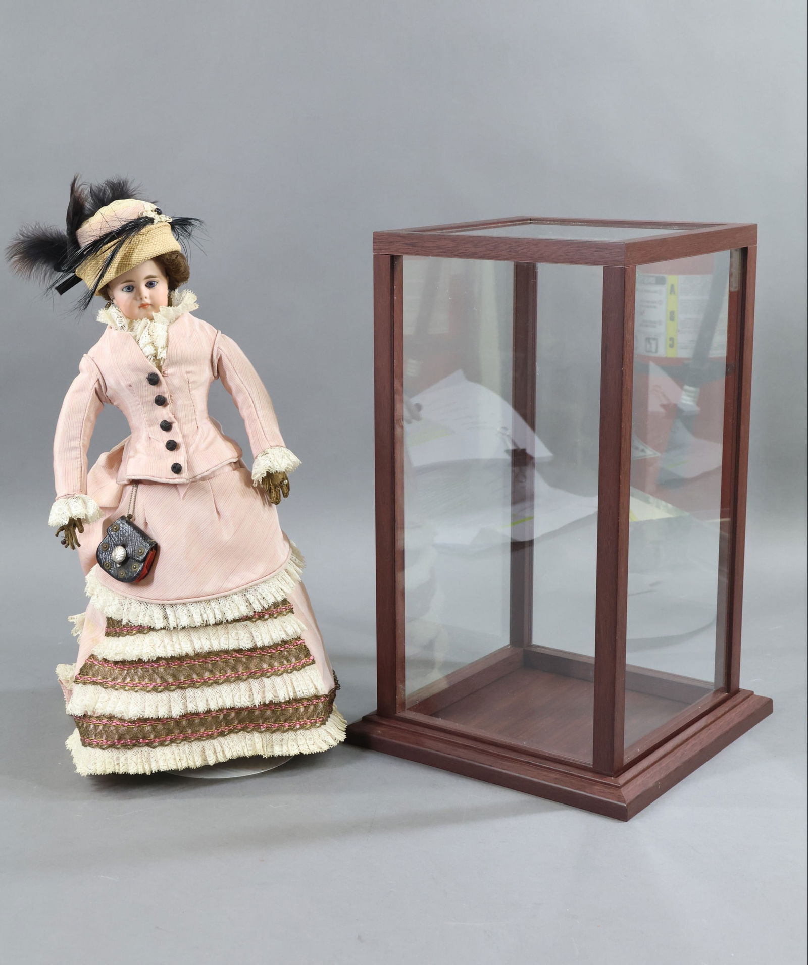 GERMAN BISQUE FASHION DOLL.: LOT. It has been stated "A Not-so-Ugly Stepsister of the French Poupee". 15" 50/3 Solid dome doll with stationary blue eyes, closed mouth, pierced ears, dark brown mohair wig. Cloth body with tan leat