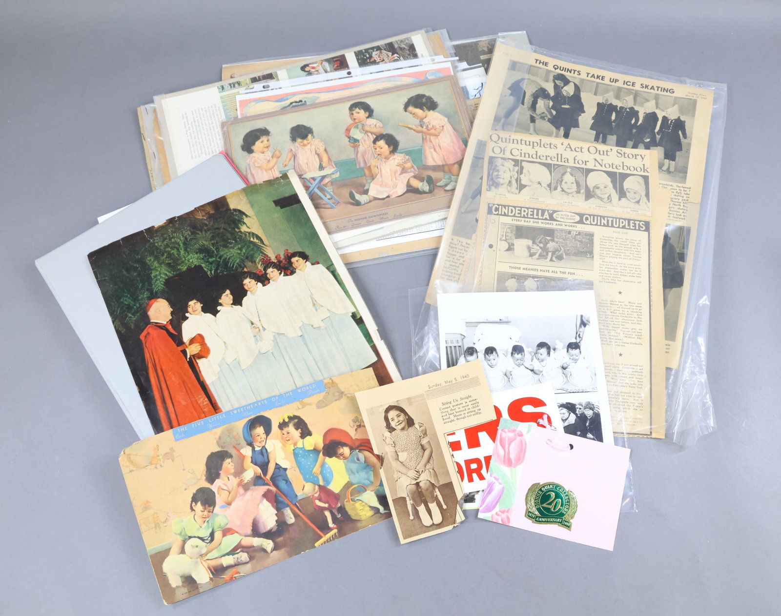EPHEMERA - DIONNE.: LOT of newspaper, magazine articles, photos, pictures of the Dionne Quintuplets. 1935 And forward as the girls got older. Some doll related. Also, information on the Dionne Collectors Club. Good refer