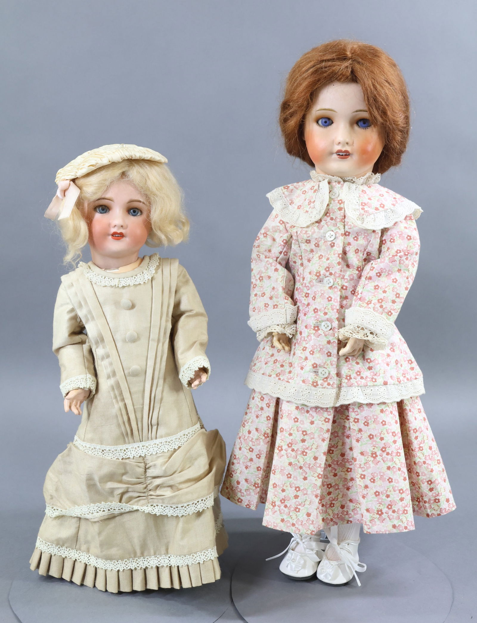FRENCH BISQUE DOLLS.: Pair of 71 UNIS FRANCE 149 301 R (in circle) dolls. Both dolls have blue sleep eyes, open mouths, high cheek coloring, mohair wigs, papier mache jointed bodies. They have both been redressed in vintag