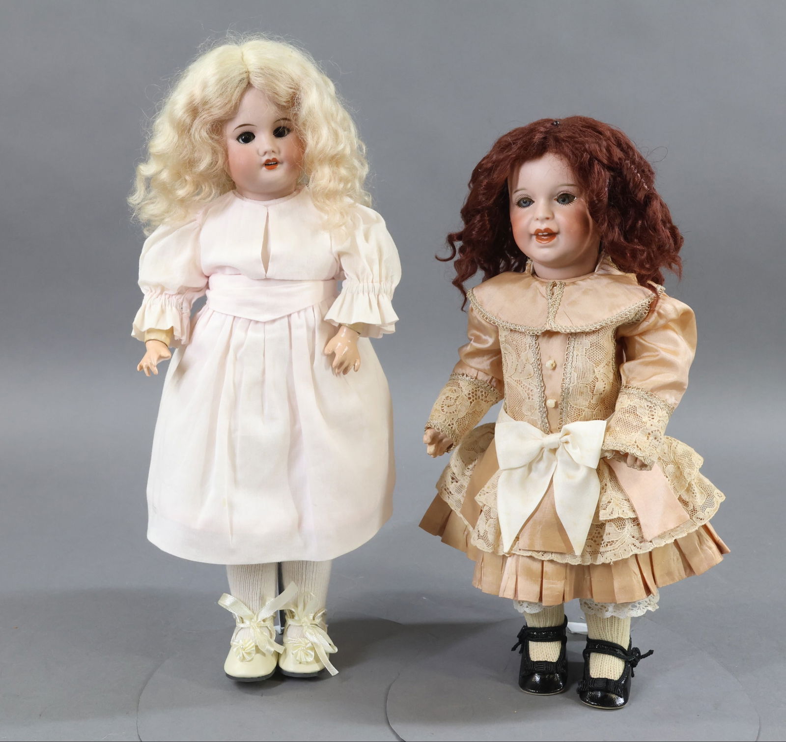 FRENCH BISQUE DOLLS.: Pair of S.F.B.J. dolls. Both dolls have sleep eyes, very curly mohair wigs, papier mache bodies. Doll 1) 13" 21 S.F.B.J. 236 PARIS 4 Character doll. Blue eyes, open/closed smiling mouth with (2) upper