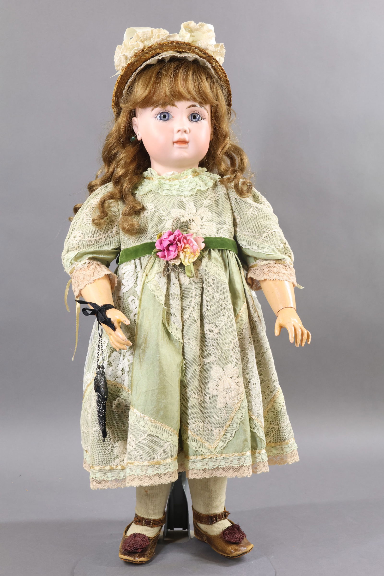 FRENCH BISQUE DOLLS.: 24" J. STEINER Cie S.G.D.G. PARIS FIRE A 15 doll. Stationary blue eyes, closed mouth, pierced ears, cork pate, curly brown French HH wig. Papier mache jointed body marked (red stamp) BEBE "LE PARISIAN