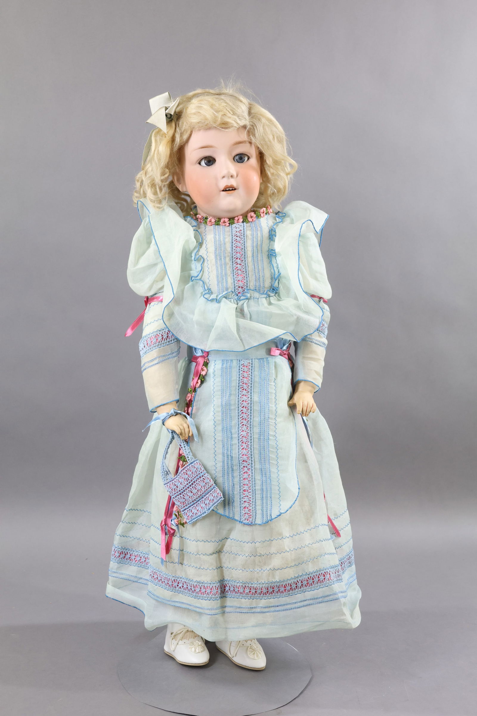 GERMAN BISQUE DOLLS.: 28" 10633 11 GEBRUDER HEUBACH GERMANY shoulder head character doll. Blue sleep eyes, open mouth, blonde mohair wig. Pin jointed leather body (Dorothy Dainty paper label on chest) with composition lowe