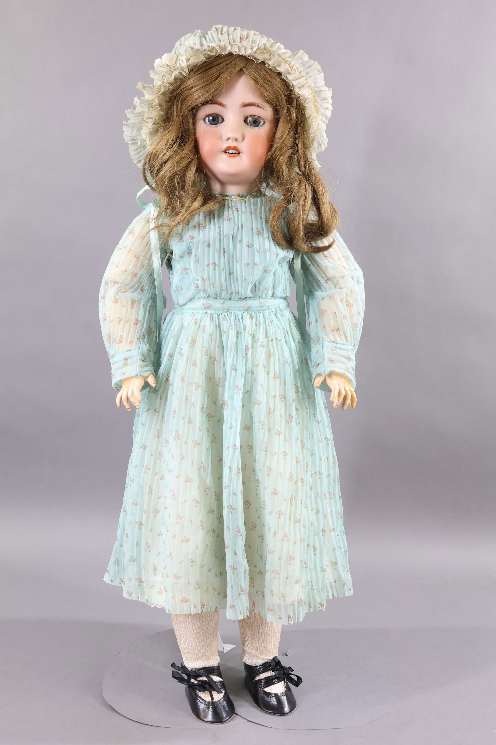 GERMAN BISQUE DOLLS.: 30" C.M. BERGMANN SIMON & HALBIG 13 1/2 Doll. Blue sleep eyes with fluffy lashes, open mouth, pierced ears, brown HH wig. Papier mache ball jointed body. Dressed in vintage pale blue nylon delicate ac