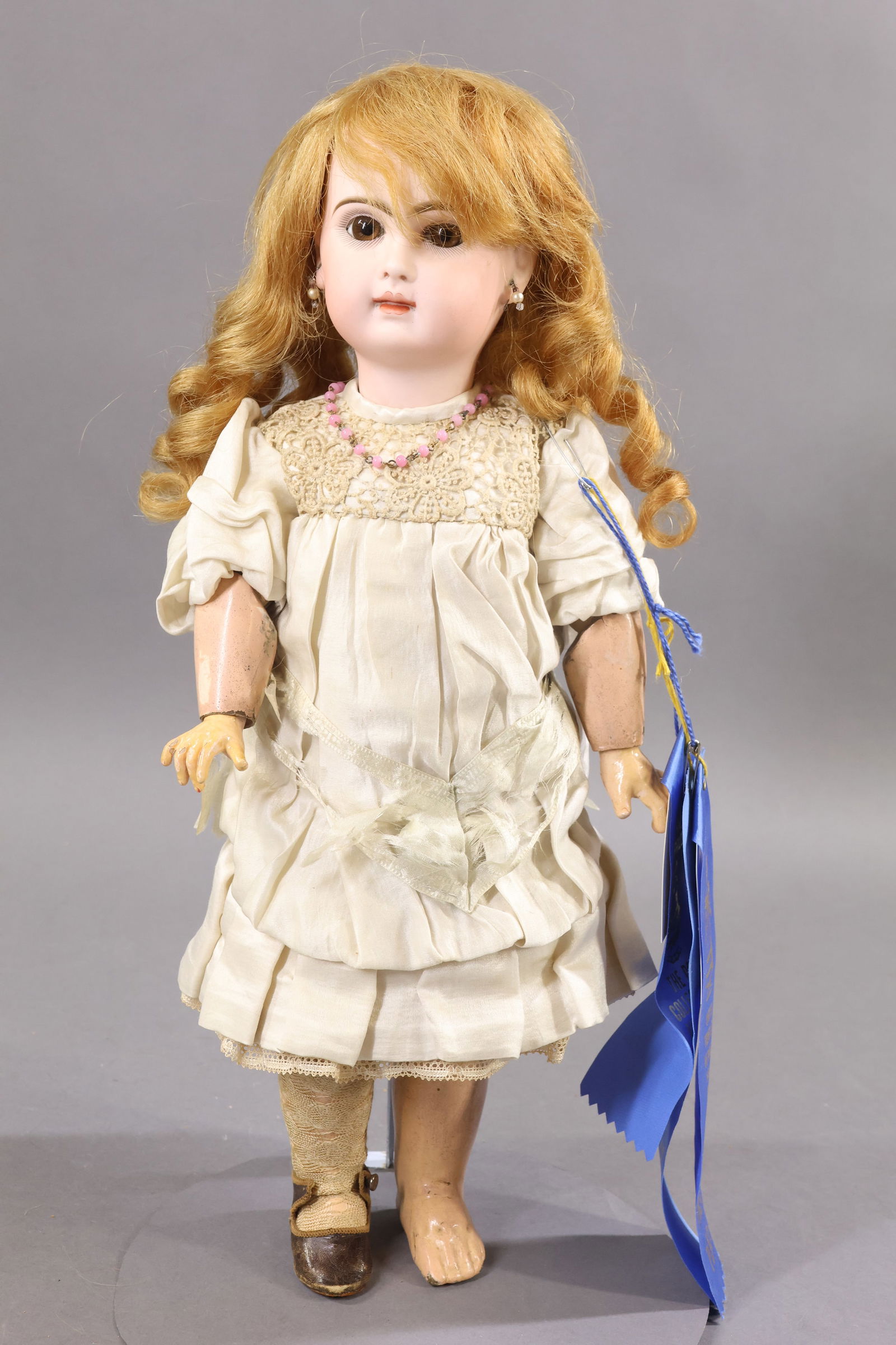 ANTIQUE FRENCH BISQUE HEAD DOLL.: 17" (Red Stamp) TETE JUMEAU 7 Doll with brown paper weight eyes, closed mouth with space between lips, pierced ears, long curly auburn FRENCH HH wig, molded pate. Papier mache jointed body marked (blu