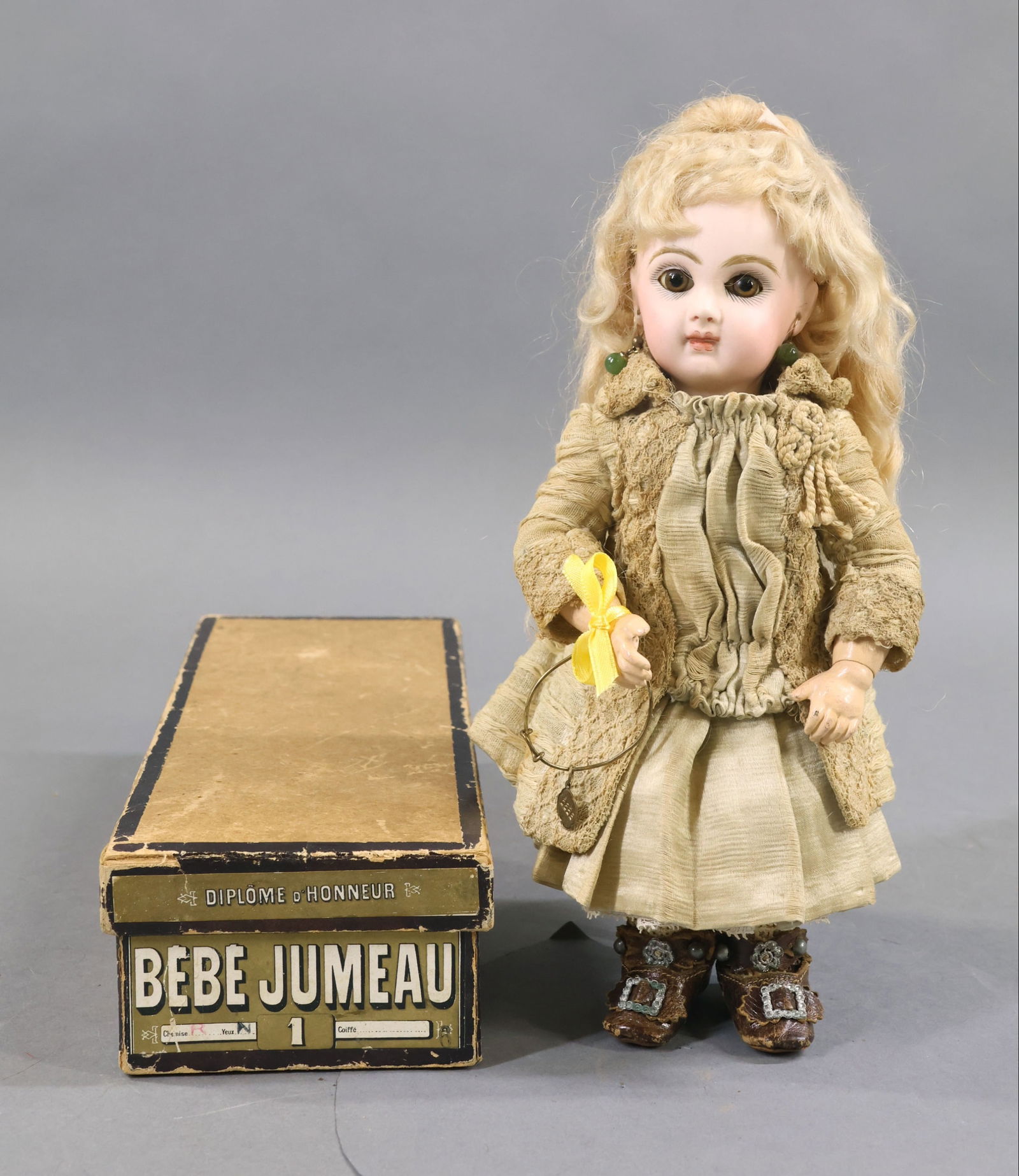 ANTIQUE FRENCH BISQUE HEAD DOLL.: 9" (Red stamp) DEPOSE TETE JUMEAU Bte. S.G.D.G. 1 Doll in factory original box. She has brown paper weight eyes, closed mouth, pierced ears, long blonde mohair wig, cork pate. Papier mache jointed bod