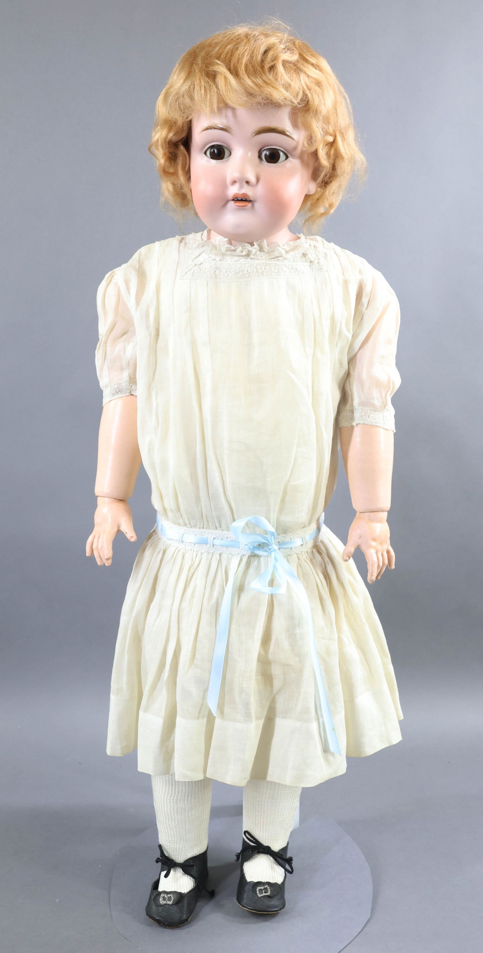 DOLL: LOT. Doll - 28" DEP 154 14 MADE IN GERMANY shoulder head doll with brown sleep eyes, open mouth, strawberry blonde mohair wig, plaster pate. Papier mache wood ball jointed arms, pin jointed leather bo