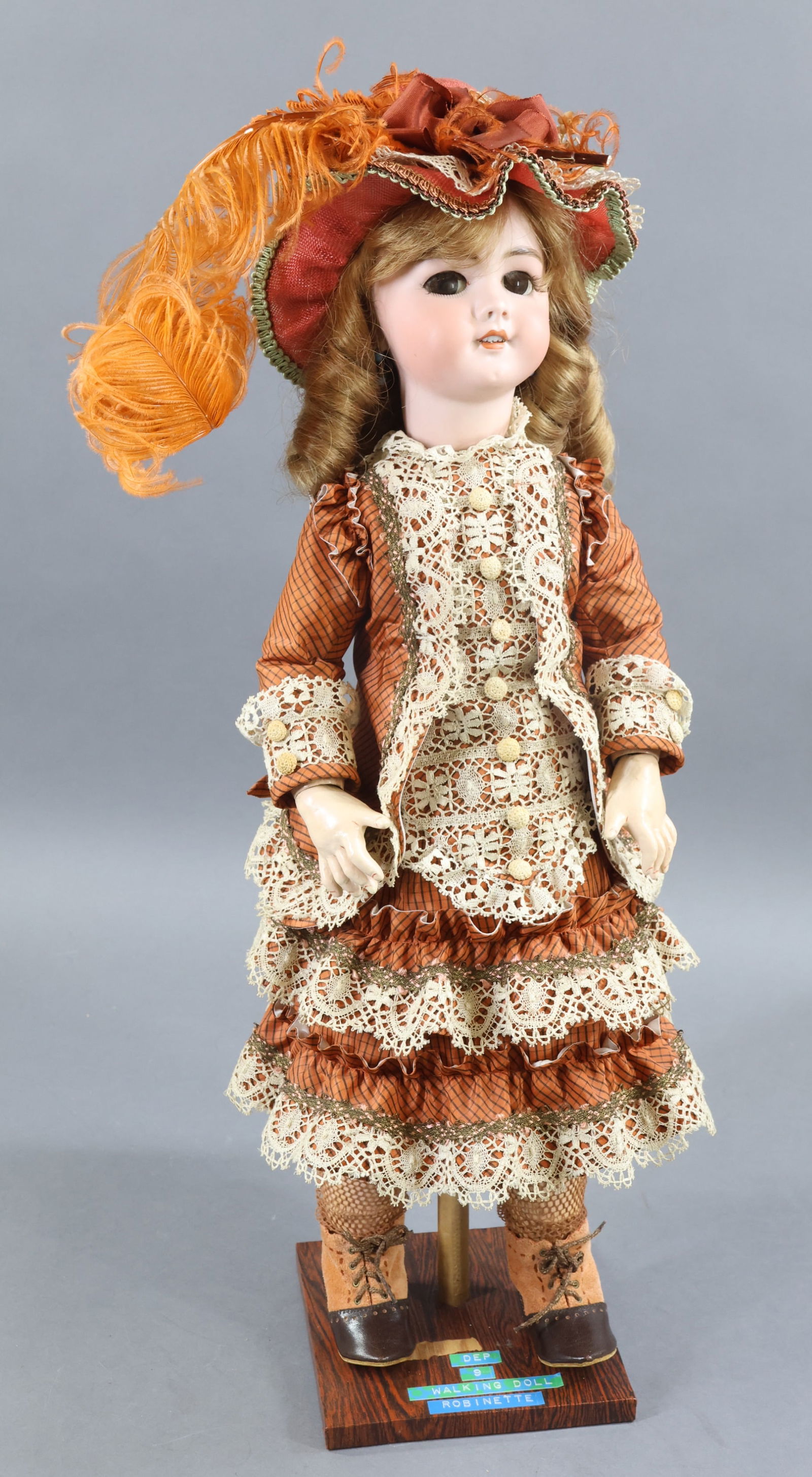 FRENCH/GERMAN BISQUE DOLLS.: 23" DEP 9 "Walking Doll". Brown sleep eyes with added lashes, open mouth, pierced ears, curly auburn synthetic wig. Papier mache walking body with jointed arms and 1-pc, legs (walking mechanism). Nice