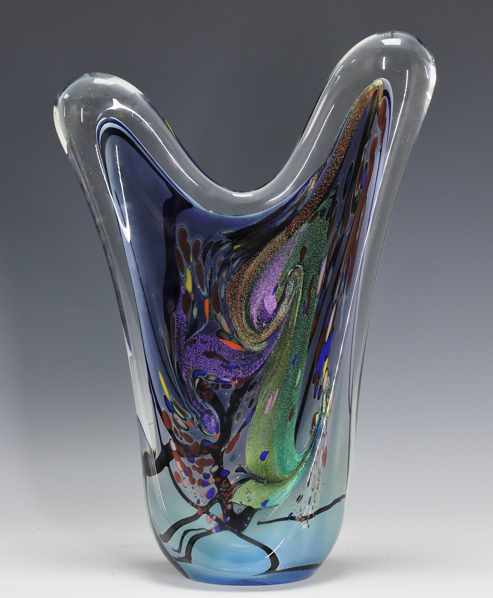 Rollin Karg Art Glass Sculpture: Abstract art glass sculpture with polychrome murrino and aventurine decoration, signed and dated 1998 at the base. There are two chips to the top. 16"h x 11"w x 5"d