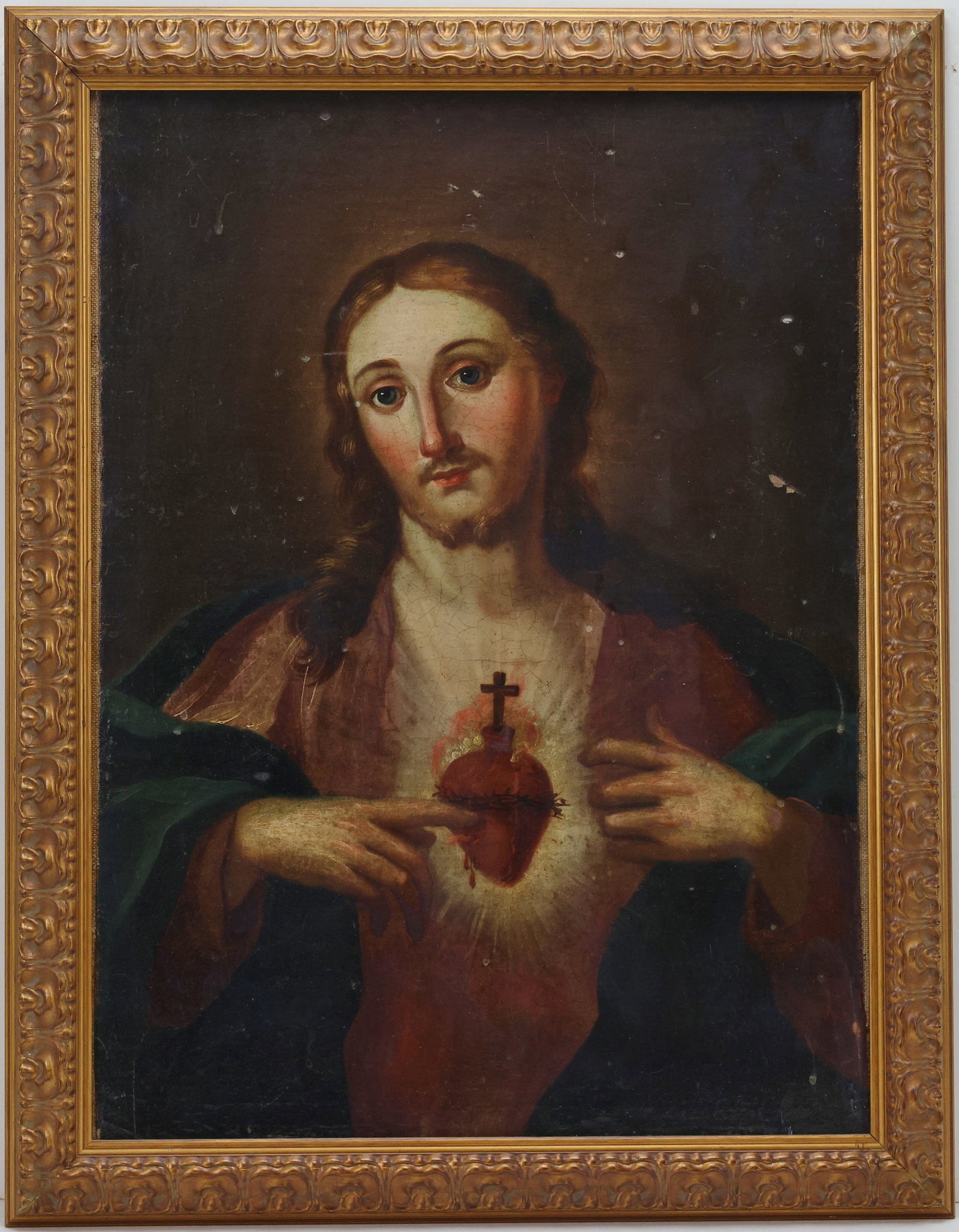 Oil on Board: Oil on board, unsigned. 19th century Continental devotional style portrait of Christ displaying the Sacred Heart. 26"h x 20"w framed