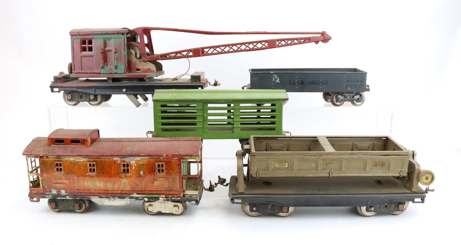 Lionel Train Cars: Standard gauge crane car #219, cattle car #113, automatic dump car #218, caboose #517 and Lake Shore gondola #112.