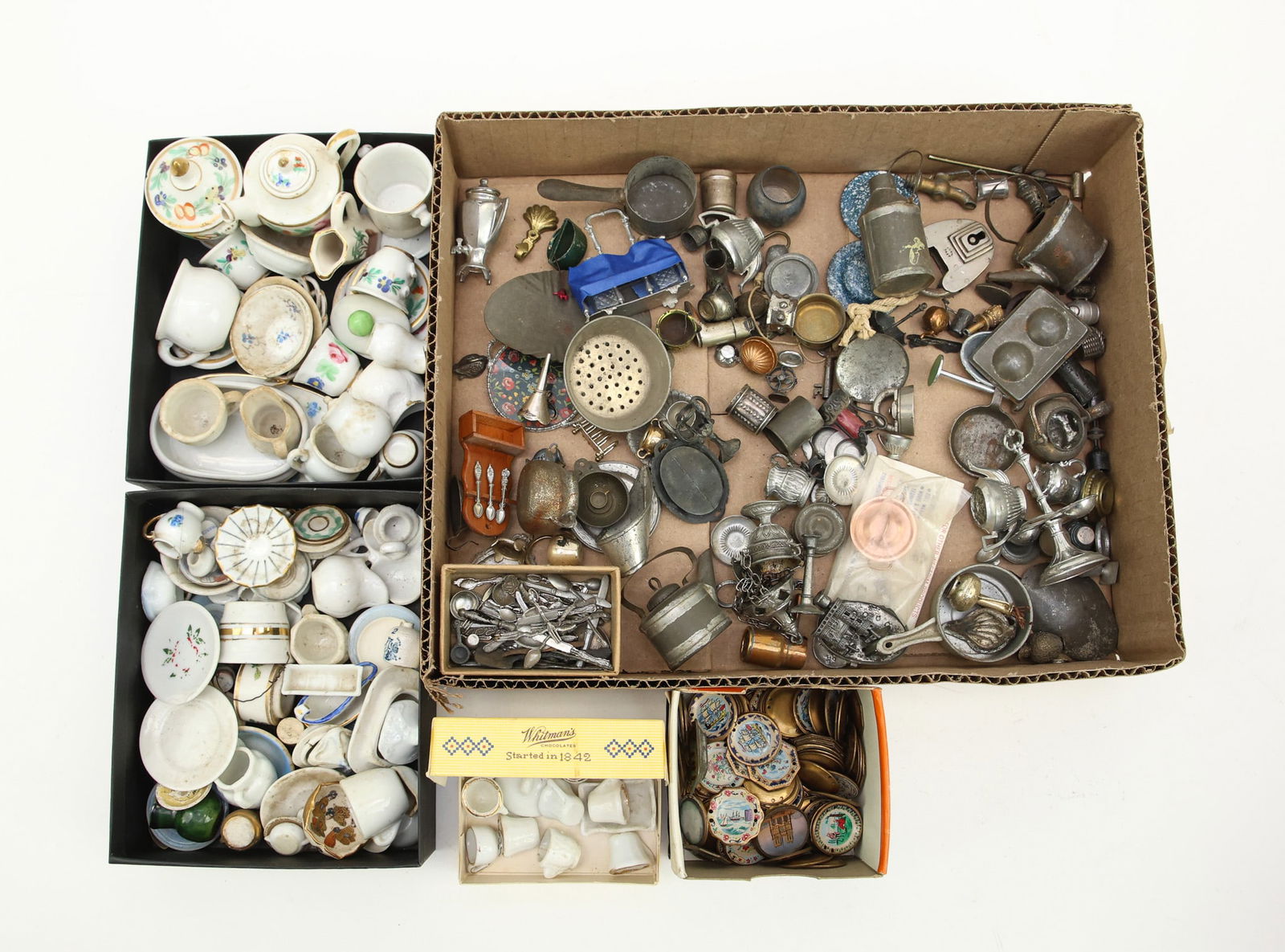 Miniature Doll Kitchenwares: Porcelain coffee and tea cups, saucers, creamers, painted plates, metal cookware and flatware. Condition varies.