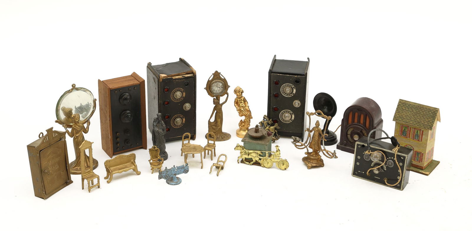 Miniature Doll Decoratives and Housewares: Gilt and bronze accent decoratives to include a figural clock, mirror, candleholder, sculptures, a table, chairs, settee, and cabinet; safes, radios, paper house, and a firetruck. Condition varies.