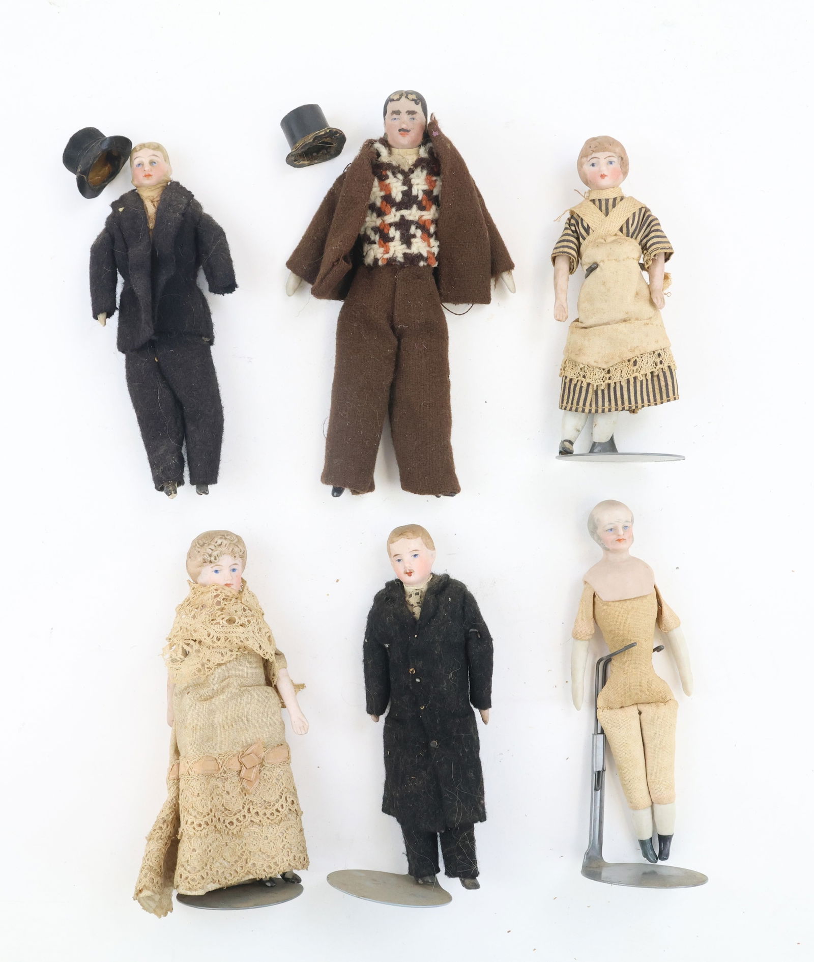 German Bisque Head Dollhouse Dolls: German character/dollhouse dolls (6) including formally dressed men and women, one female is not fully dressed. All have bisque heads with painted features and hair, other notables include removable t