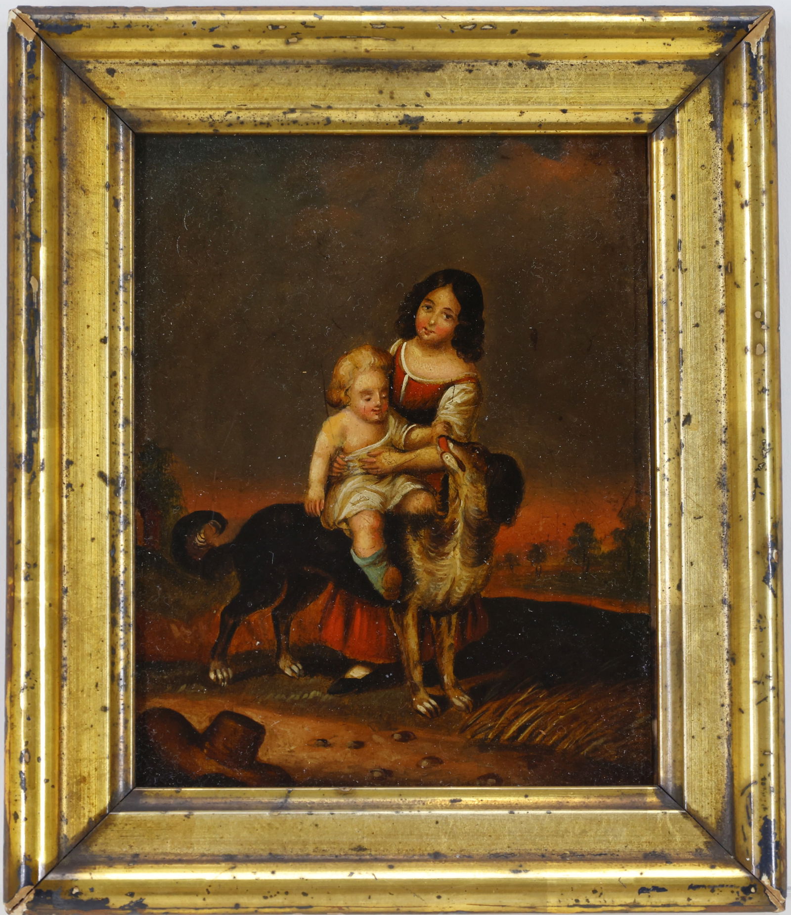 Oil on Board: Continental School, oil on board. Dark amber landscape with a young child dressed in a white tunic and riding a dog, an older adolescent girl is steadying rider and wearing a full length red dress. 5"