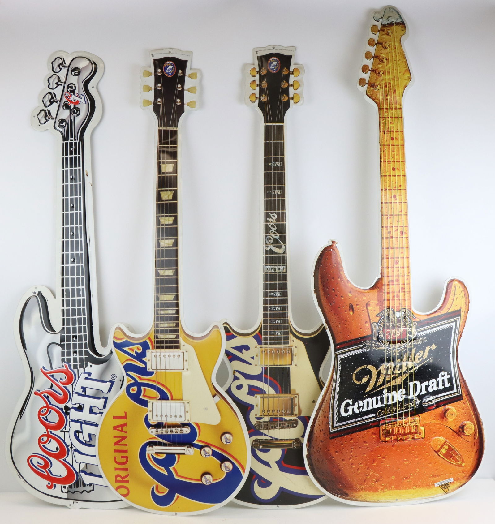 Guitar shaped advertising: 4 metal beer advertising signs. Coors, Coors Light, and Miller Genuine Draft guitar signs. 47.75"h x 18"w
