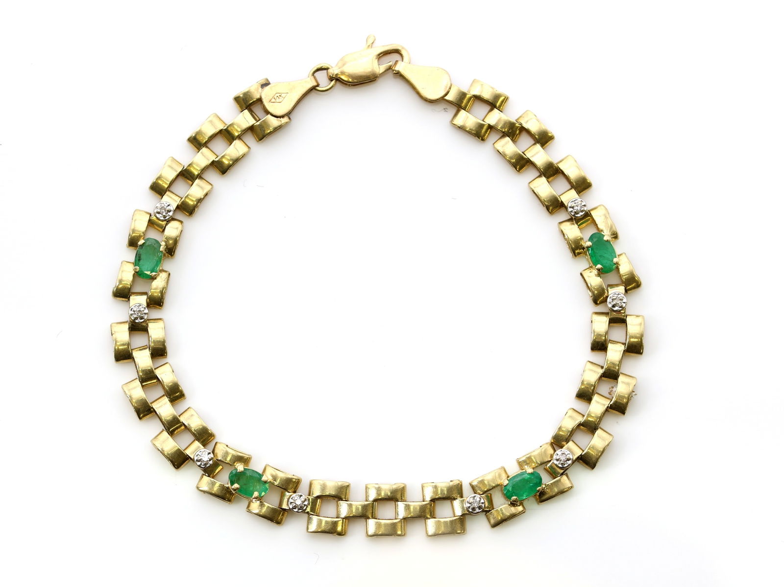 14k YG Emerald Diamond Bracelet: 14k yellow gold bracelet with alternating oval cut emeralds totaling approx. .5 carats and round diamond accents, 7", 4.4dwt.