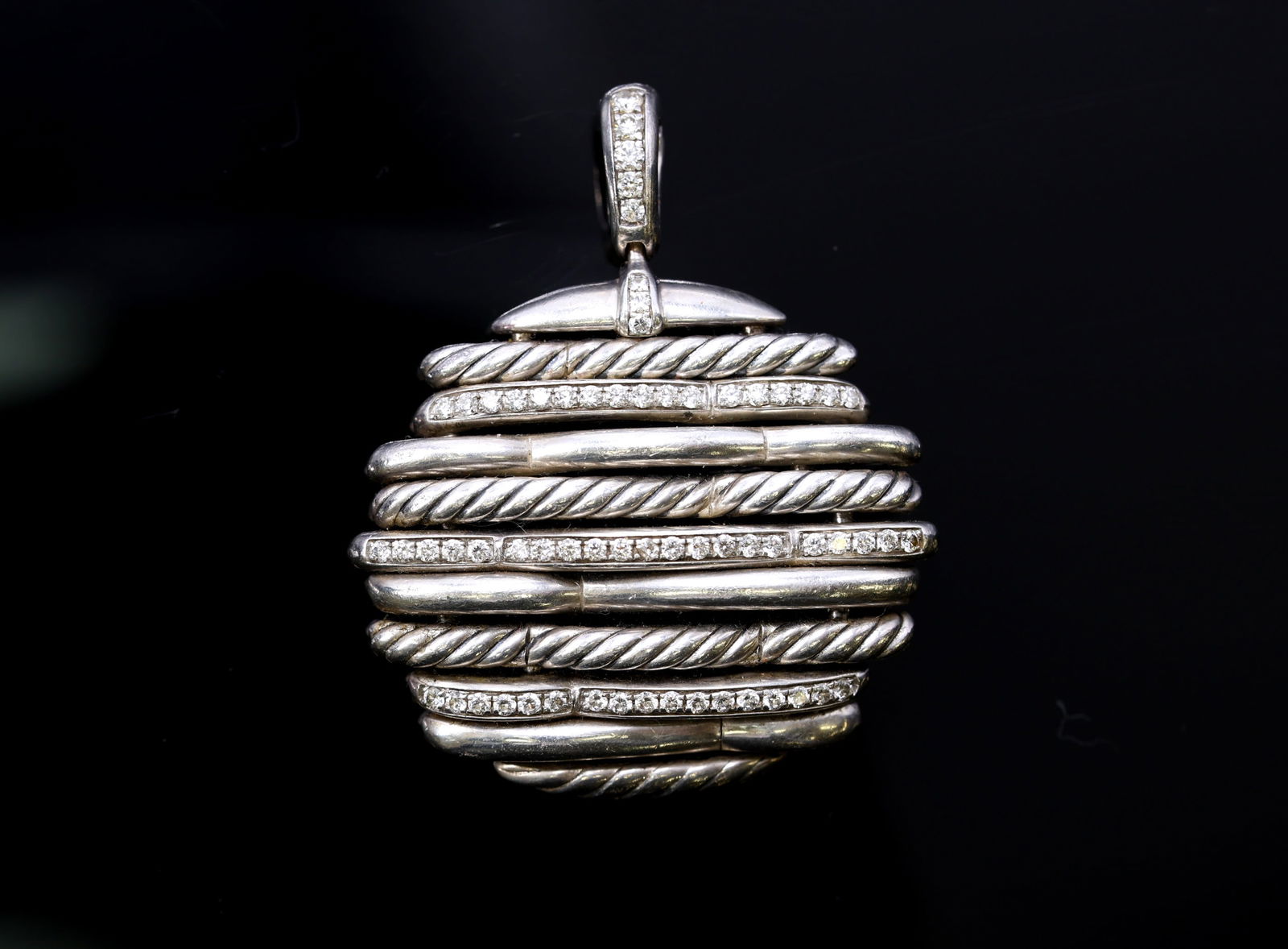 David Yurman "Tides" Diamond Sterling Silver Pendant: David Yurman "Tides" pendant in sterling silver with alternating cable and diamond pave bands, 2"h x 1.5"w, 20.0dwt.