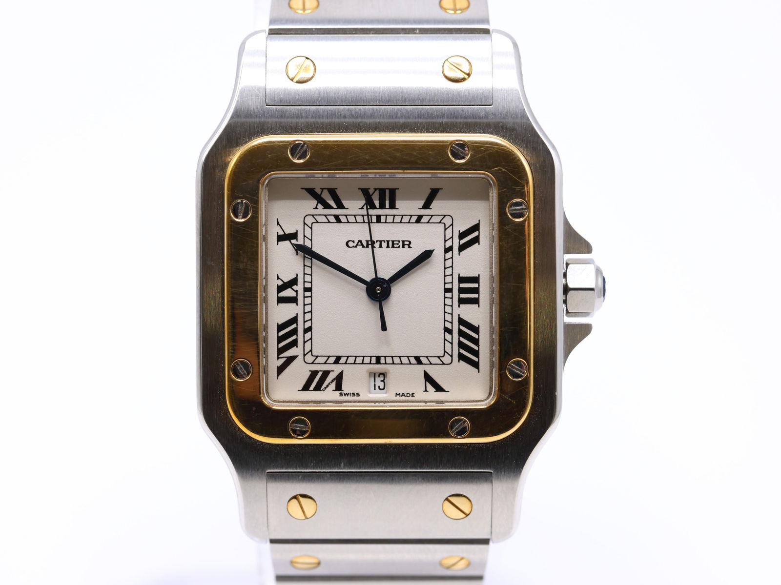 Cartier Santos Galbée, Ref. 1566 Wristwatch: Gold and stainless steel case, 29mm x 41mm, with yellow gold bezel secured by eight screws, silver dial with Roman numerals, blued steel hands, and date window at 6 o’clock. Sapphire crystal. Powere