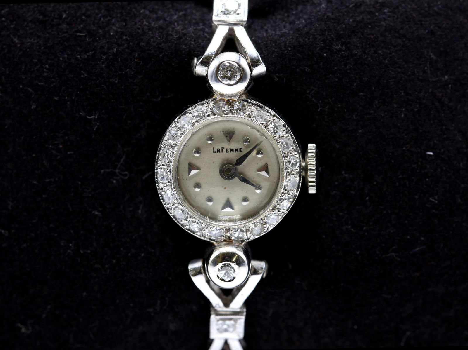 14k WG Diamond La Femme Ladies Wristwatch: 14k white gold La Femme ladies’ wristwatch set with round and marquise-cut diamonds throughout the bezel and bracelet. Manual wind movement, diamond-accented dial, 6" length, 9.5dwt. Vintage Art Dec
