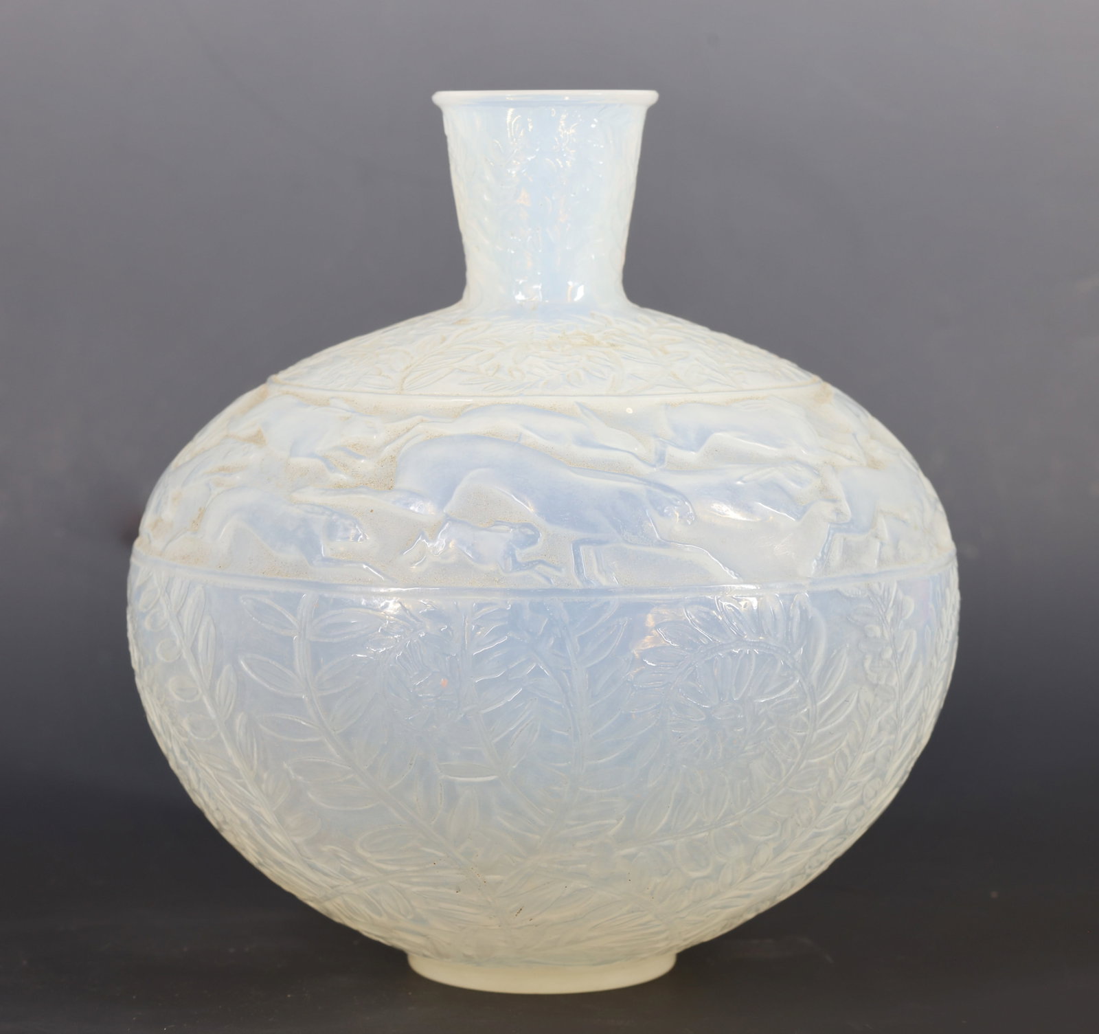 Rene Lalique "Lievres" Vase: French frosted molded glass vase, model no. 942, decorated with leaping hares and foliage in relief. Signed "R. Lalique" in the mold, with hand etched "France". 7"h x 5"w