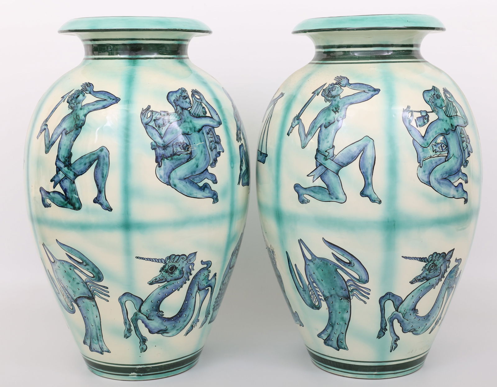 Deruta "Zodiac" Vases: Deruta manufactured ceramic amphora vases, glazed in shades of cream, blue, and green underglaze and decorated with the symbols of the zodiac. 1950s. Marked and numbered under the base. 20.5"h x 12"w