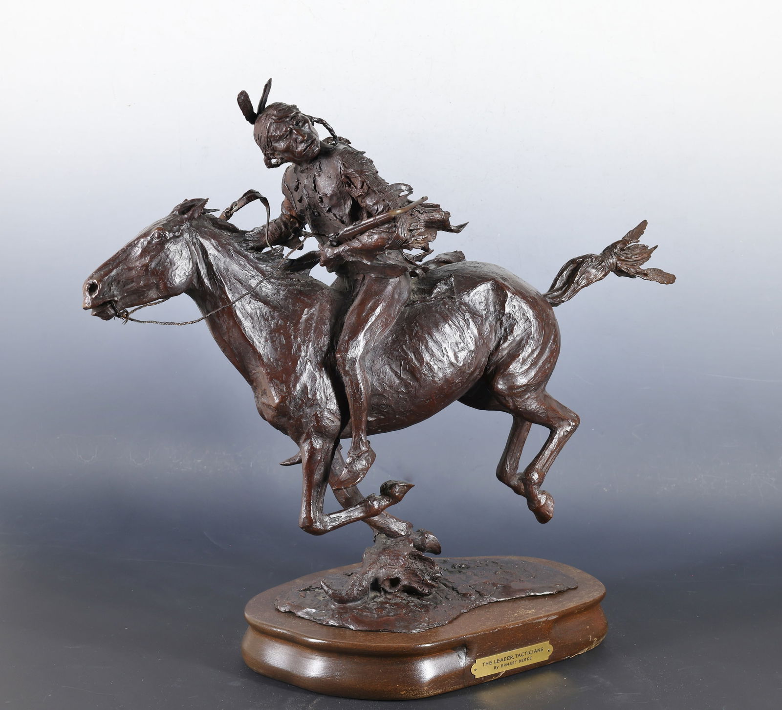 Ernest Berke (1921 - 2010): Bronze sculpture, "The Leader (Tacticians)", depicting a Native American man on horseback, impressed signature to the base, numbered 1/12, dated 1969. Mounted to a wooden stand with nameplate. 19"h x