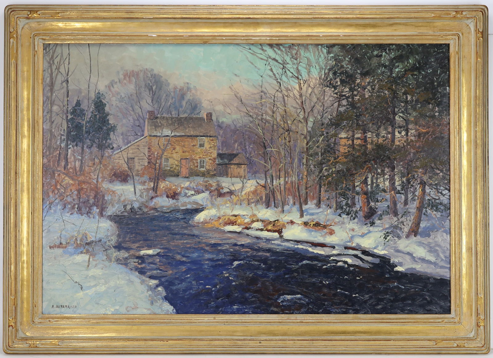 Alfred Nunamaker (1915 - 1988) in Newcomb-Macklin Frame: Oil on canvas, "Trout Stream", SLL. Winter landscape with stone farmhouse along a snow covered stream, in a gilt carved Newcomb Macklin frame. 24"h x 36"w and 30.5"h x 42"w framed