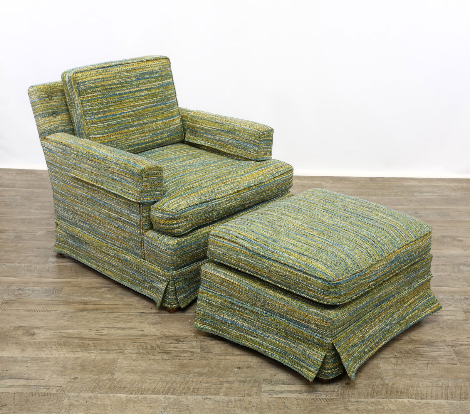 Lounge Chair and Ottoman: Lounge chair and matching ottoman with walnut square tapered legs and woven polychrome upholstery. Chair 30"h x 31"w x 32"d, seat height 18", ottoman 16"h x 26"w x 22"d