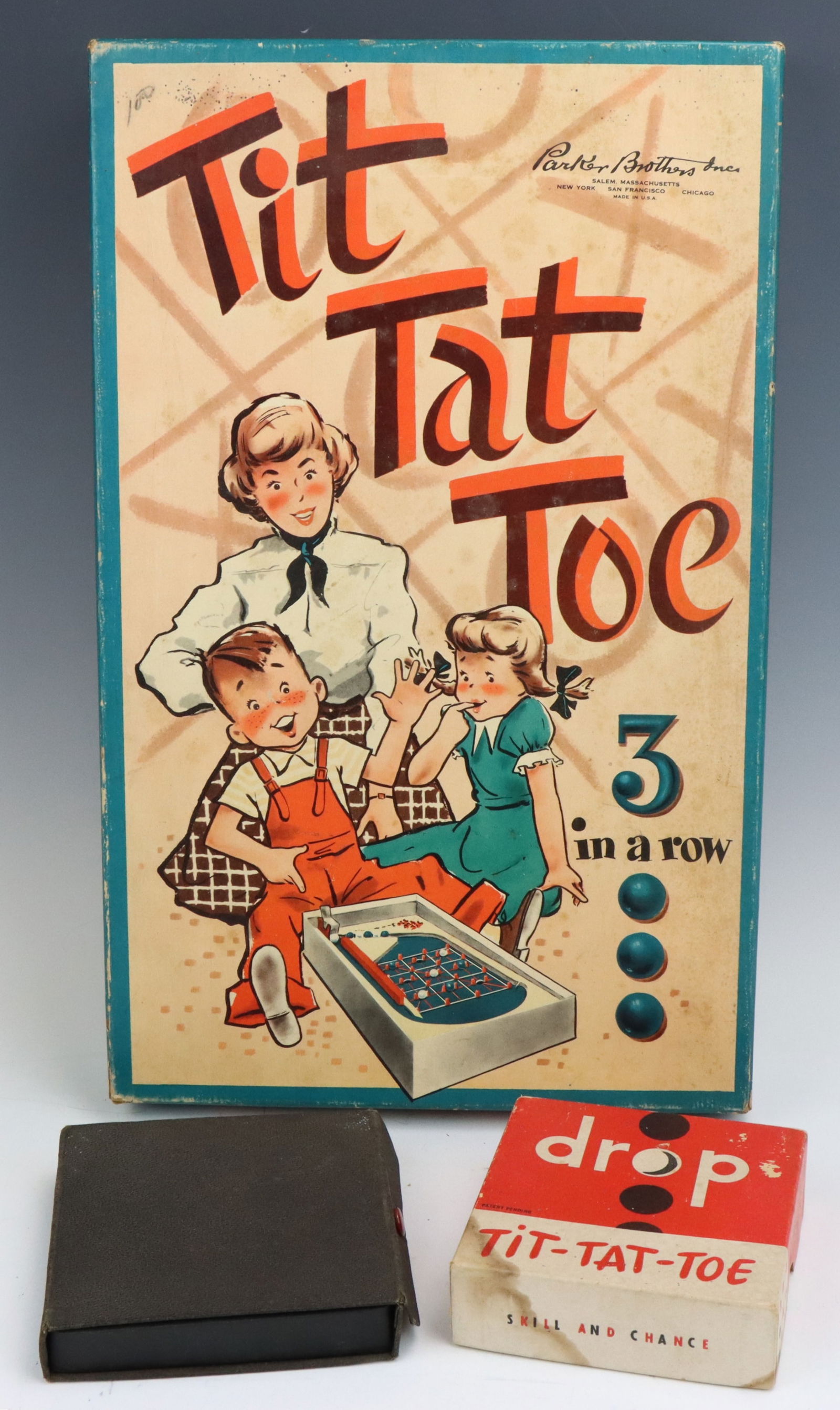 Tit Tat Toe & Vintage Games: Parker Brothers Tit Tat Toe game, c. 1930's-40's, original box. Lowe Bottoms-Up and Tit Tat Toe games with original boxes and game cards/accessories. Slight wear from age and play. Largest 1.75”