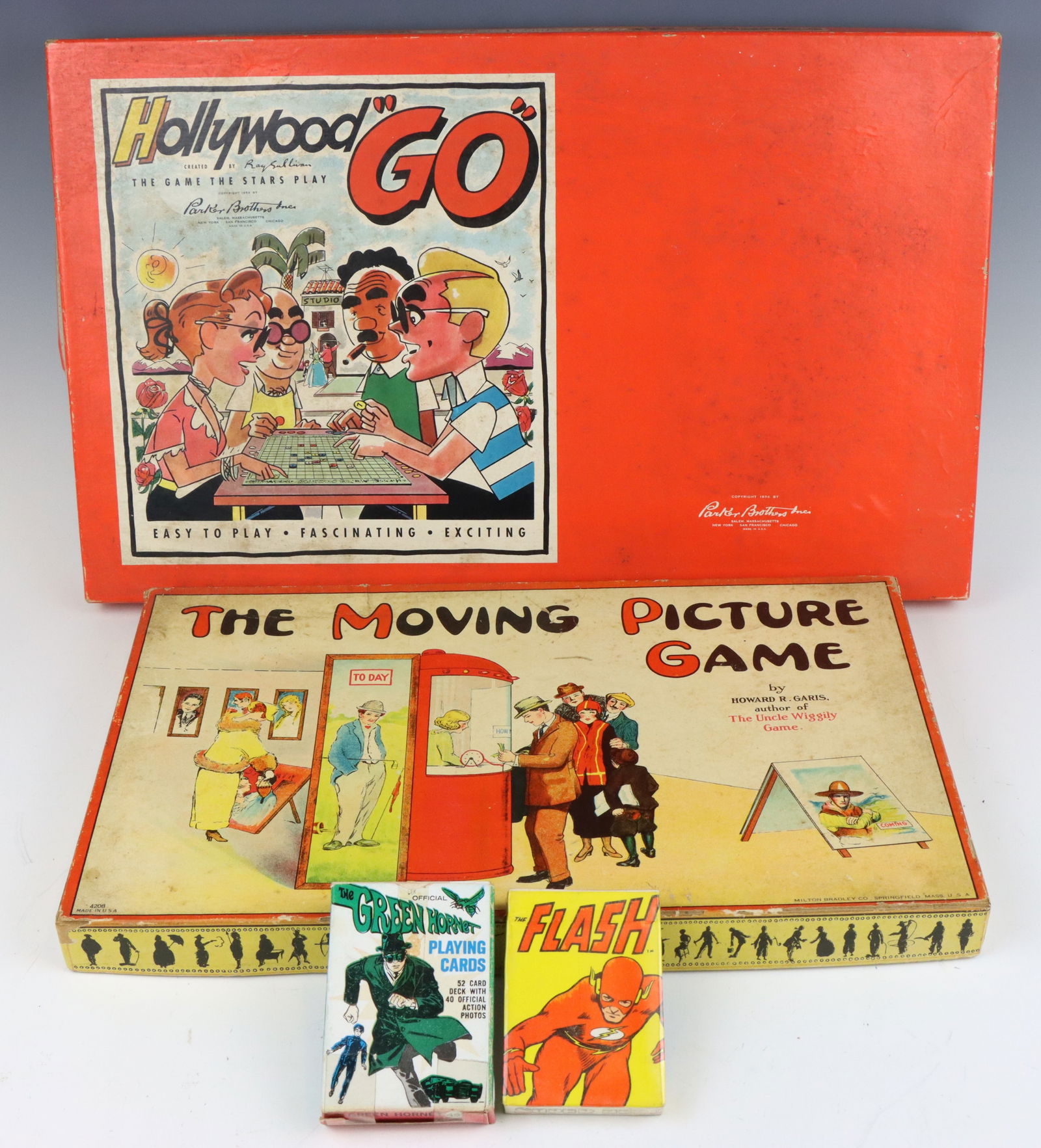 Vintage Board & Card Games: Parker Brothers Hollywood "GO" board game, c. 1954, game of finance, original box, board. Milton Bradley The Moving Picture Game, c. 1932, original box and board. Green Hornet (1966) and The Flash (19