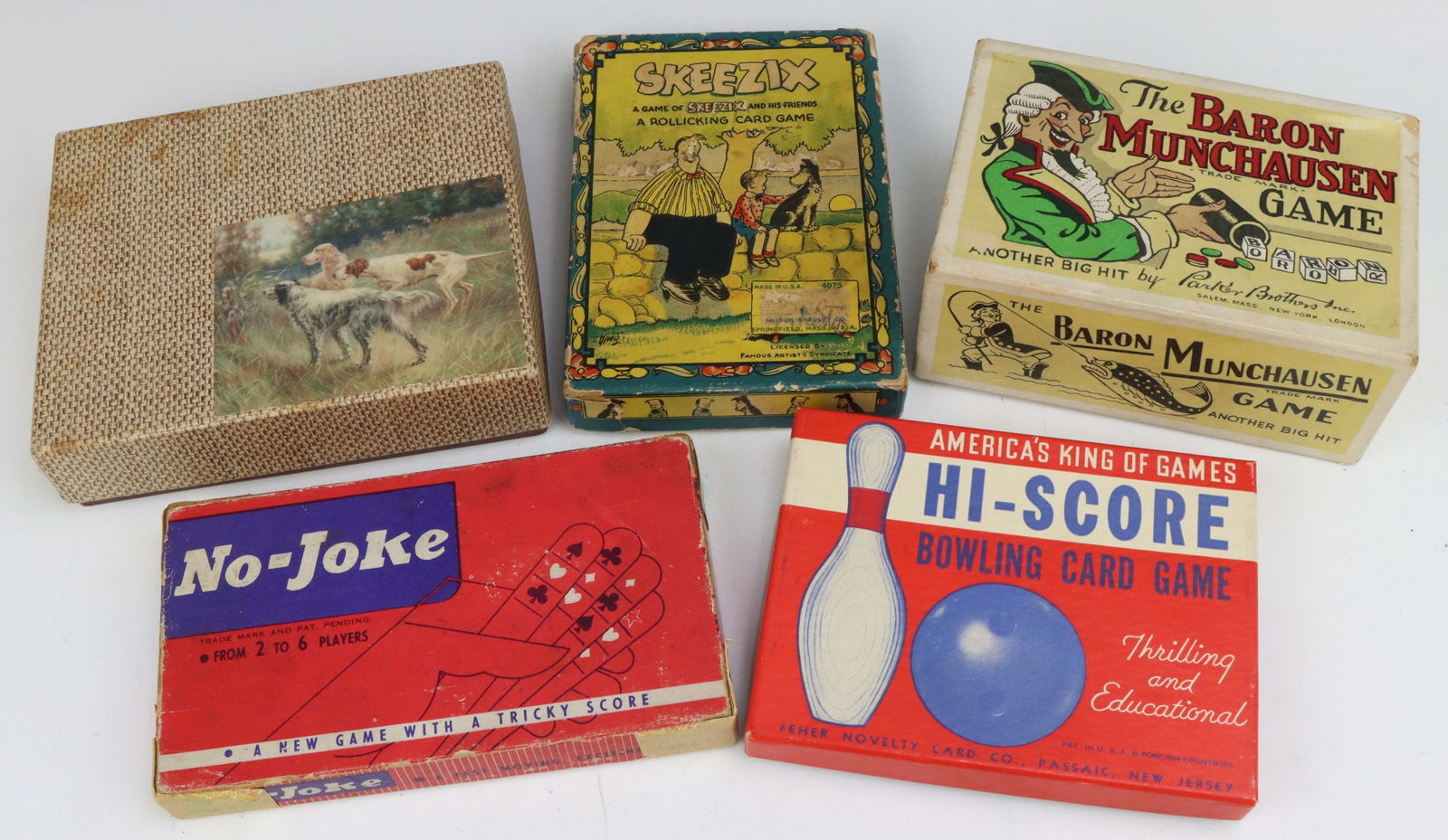 Assorted Vintage Games: Parker Brothers Baron Munchausen game, c. 1930's, original box and accessories. Hi-Score game, Feher Novelty Card Co., original box and cards. Skeezix game, Milton Bradley, based on the comic strip, G
