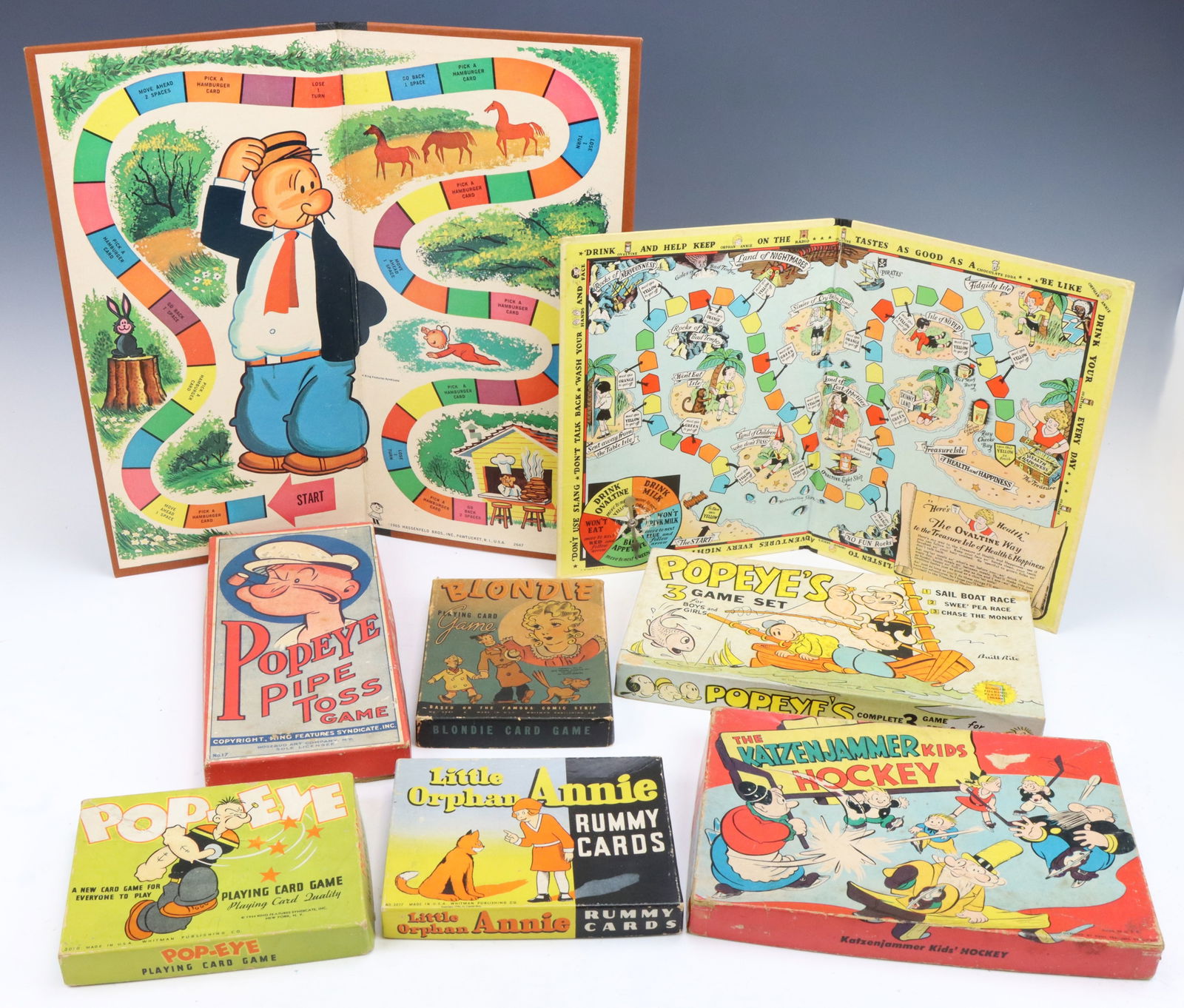 Vintage Board & Card Games: Whitman Publishing games including Blondie (1941), Popeye's Pipe Toss (1935), Popeye card game (1957), Little Orphan Annie Rummy game (1935), original boxes. Includes Little Orphan Annie Treasure Hunt
