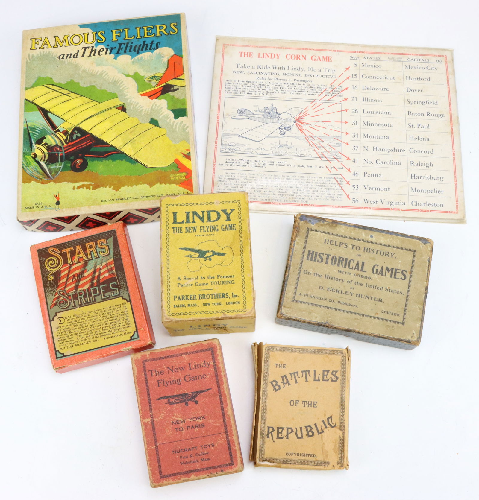 Patriotic & Educational Games: Milton Bradley Famous Fliers game, box 1”h x 6”w x 7.5”d. New Lindy Flying card games (2 versions), Stars and Stripes, Battles of the Republic and more, boxes original but have wear