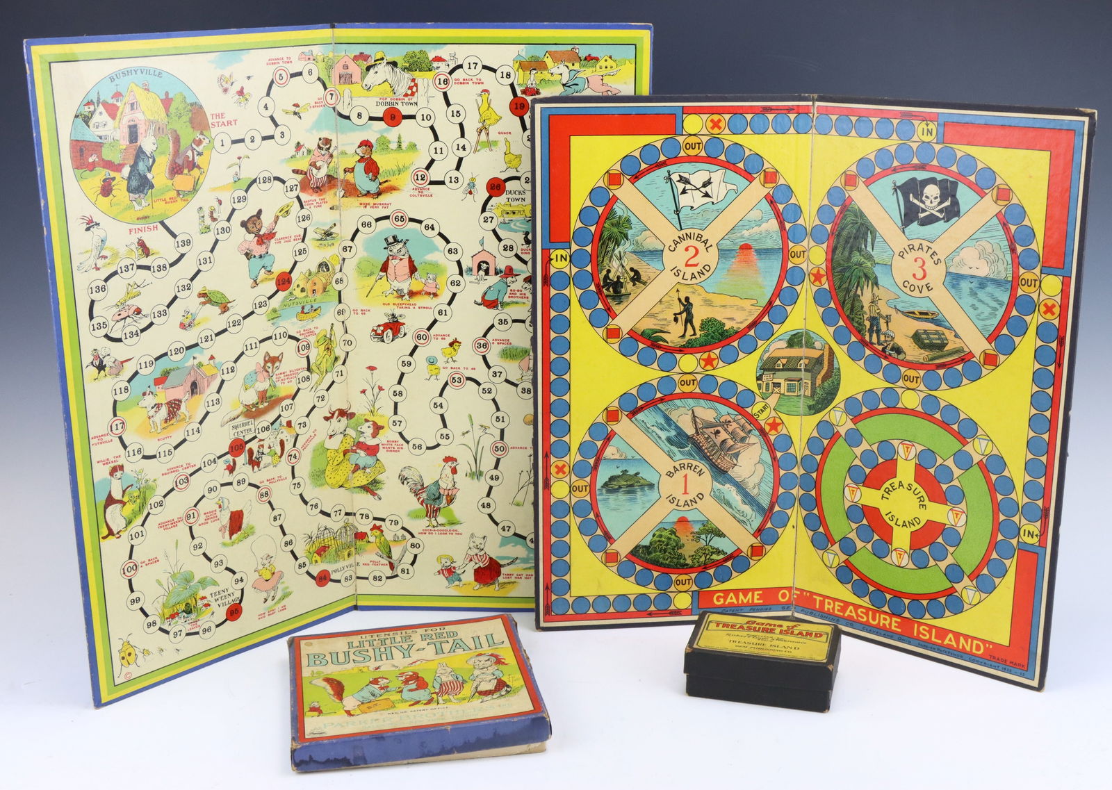 Vintage Board Games: Parker Brothers Little Red Bushy-Tail, 1921 and Game of Treasure Island by Gem Publishing Co, 1922-1923. Both have original game piece boxes with wear from age and play. Bushy-Tail board (closed) 9.25