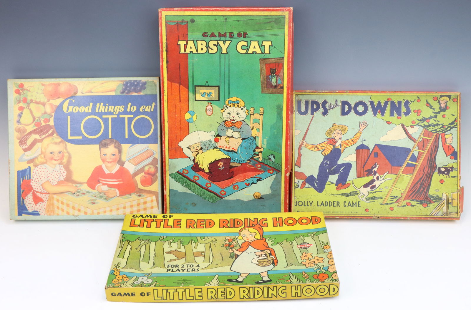 Assorted Vintage Games: Good Things to Eat food Lotto game, Milton Bradley's Game of Tabsy Cat, Milton Bradley's Game of Little Red Riding Hood and Ups and Downs. All have original game boards and boxes. Wear to boxes from a