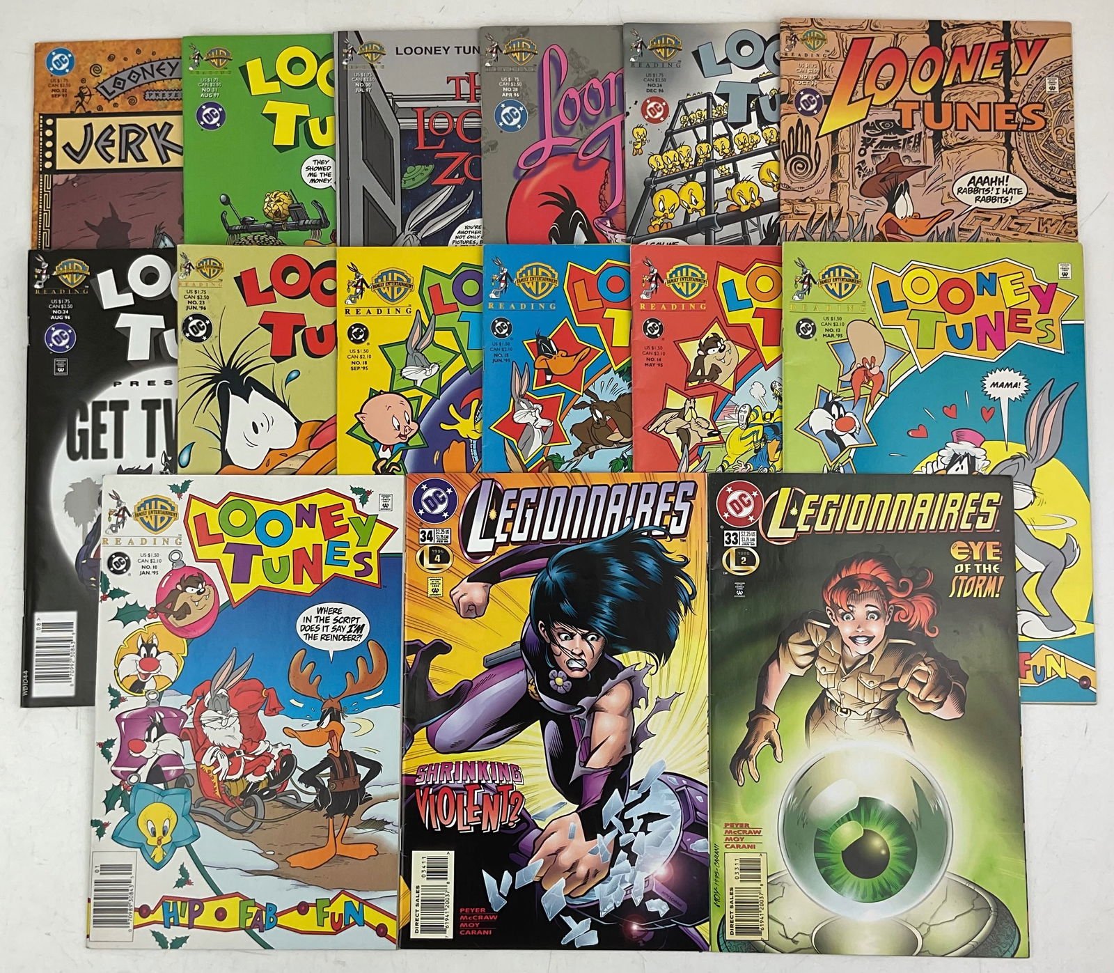 Legionnaires and Looney Tunes Comics: DC Legionnaires #33 and #34. (13) assorted Warner Bros. Looney Tunes comics with #s ranging from #10-#32. Condition varies.