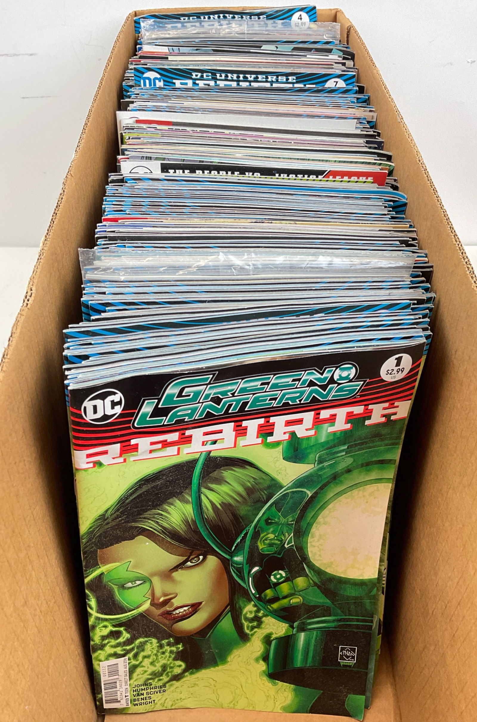 DC Comic Book Assortment: Assorted DC Comics including Justice League, Hell Blazer, Nightwing and more. Condition varies.