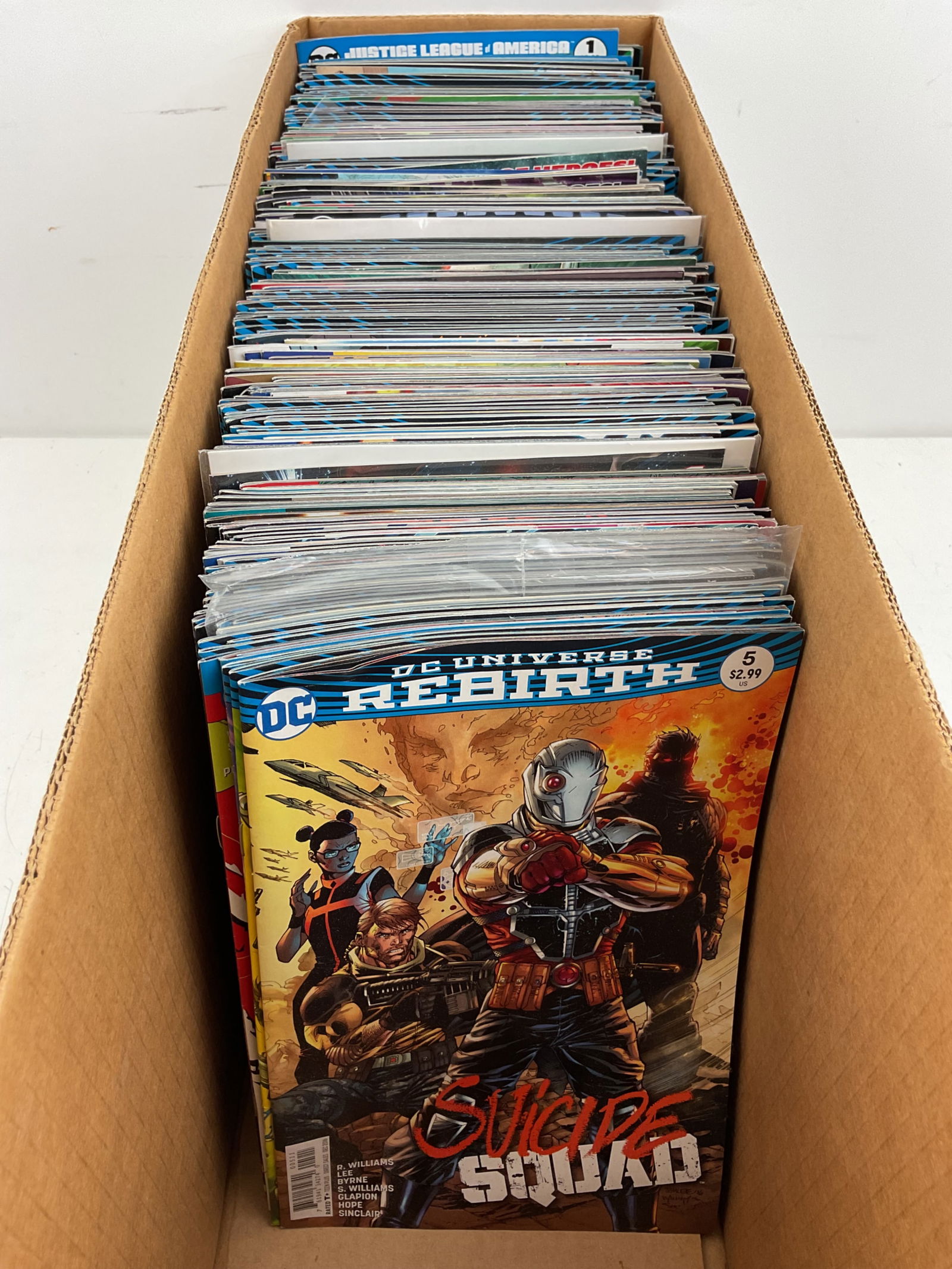 DC Comic Book Assortment: Assorted DC Comics including Rebirth Suicide Squad, Supergirl, Superman, Man of Steel and more. Condition varies.