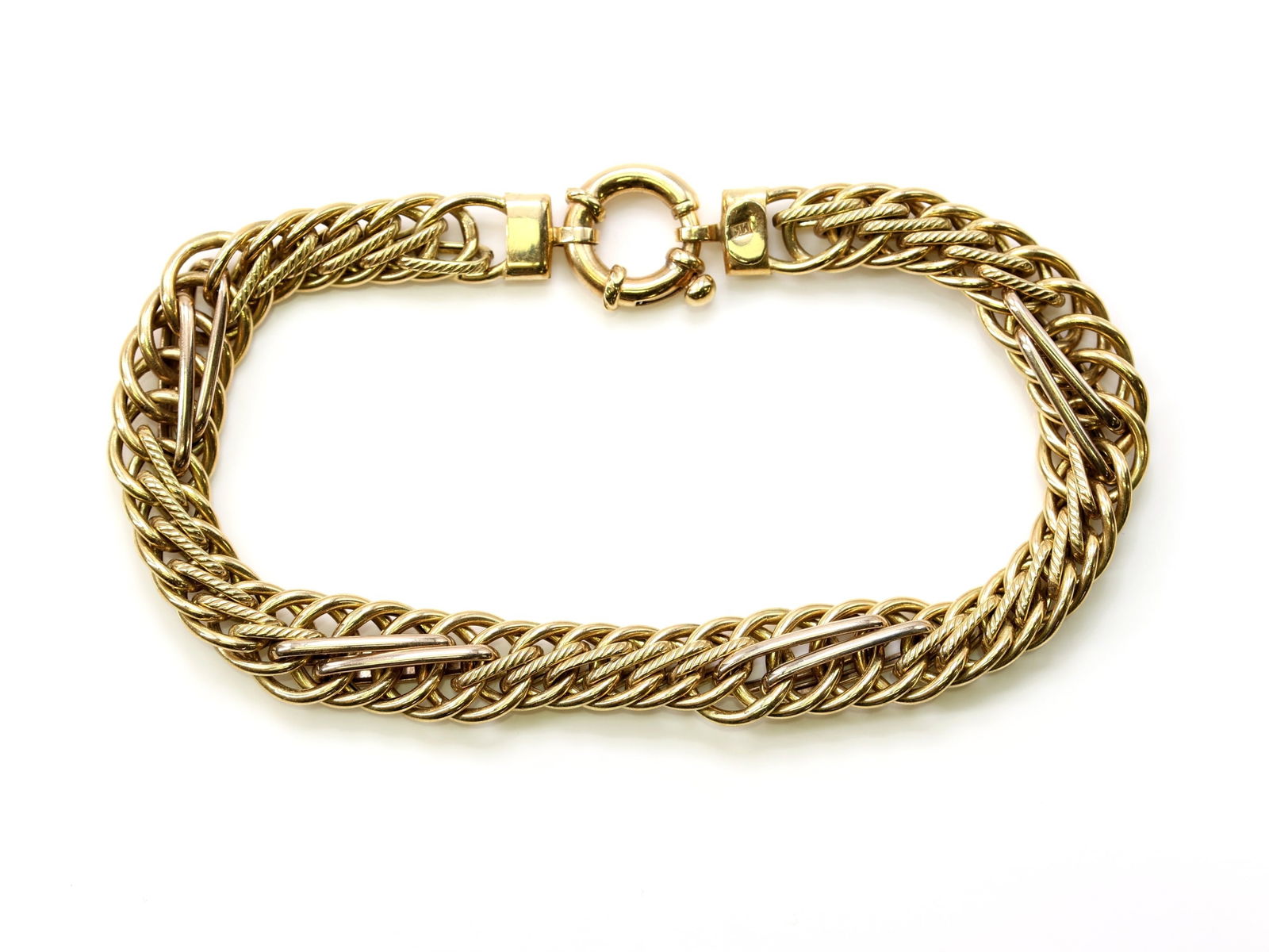 14k YG Bracelet: 14k yellow gold braided link bracelet with toggle clasp, 7" and 5.1dwt.