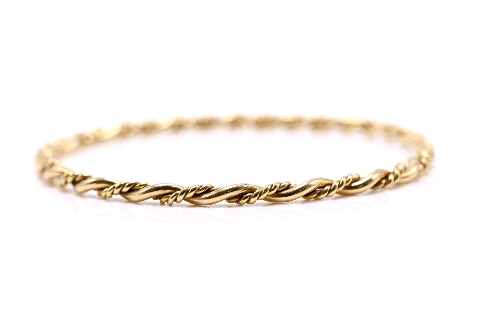14k YG Bracelet: 14k yellow gold twisted bangle bracelet, 7.5" and 9.1dwt.