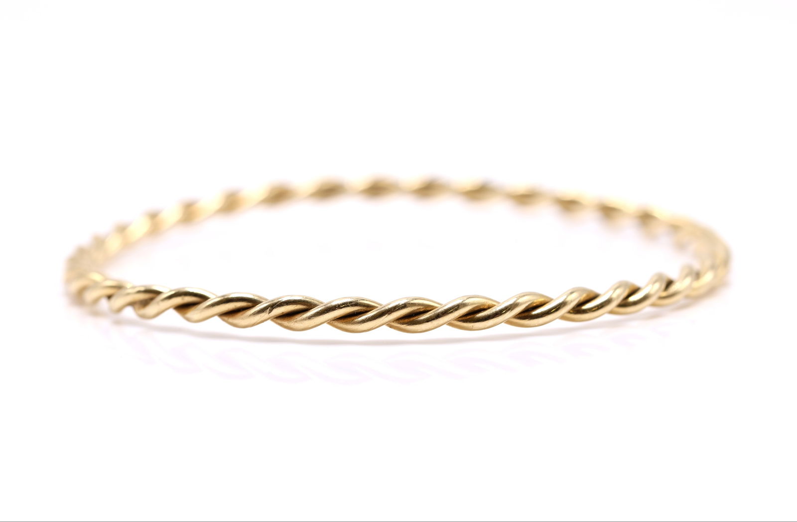14k YG Bracelet: 14k yellow gold twisted bangle bracelet, 7.75" and 9.1dwt.