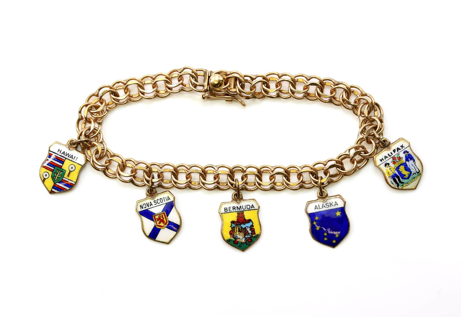 14k YG Bracelet: 14k charm bracelet, charms are 14k and enamel. all travel related.6.75" and 10.2dwt