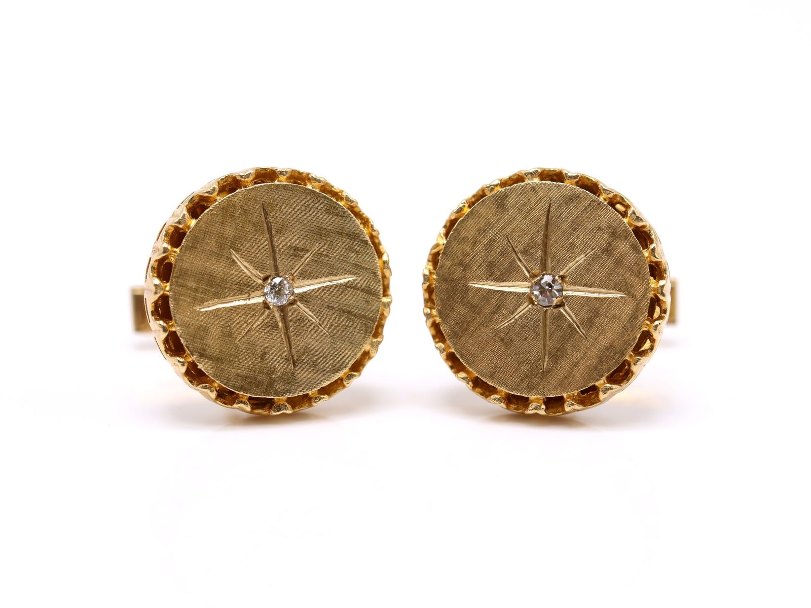 14k YG Diamond Cufflinks: 14k yellow gold cufflinks set with single diamond accents in starburst engraved round faces, 5/8" diameter and 9.3dwt.