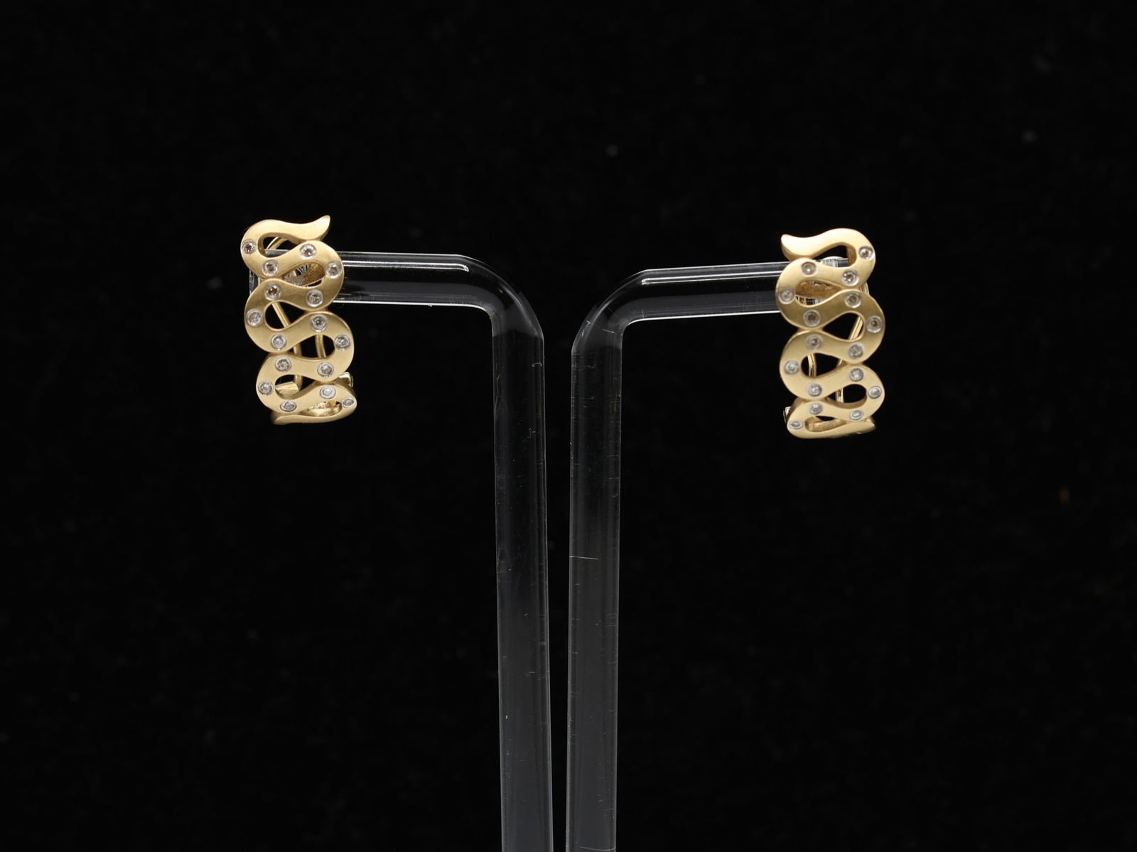 14k YG Diamond Earrings: 14k yellow gold diamond earrings with openwork serpentine motif and round cut diamond accents. 0.75" and 3.9dwt.