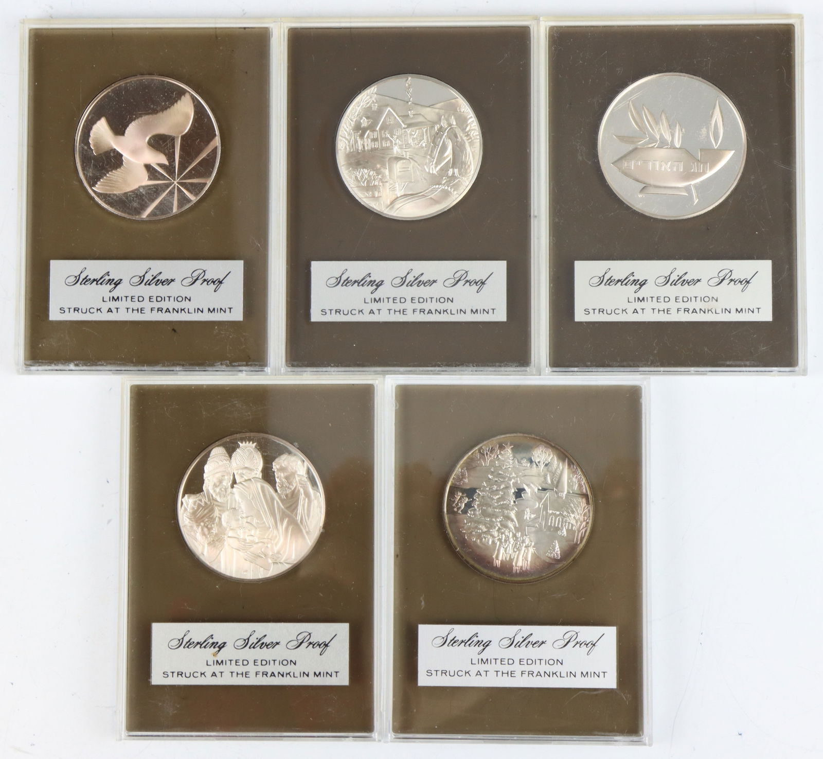 Franklin Mint Sterling Silver Holiday Medals: Holiday Medals, (5) sterling silver medals in plastic cases. Each approx. 38.5 mm and 0.8 ozt, approx. 4 ozt overall