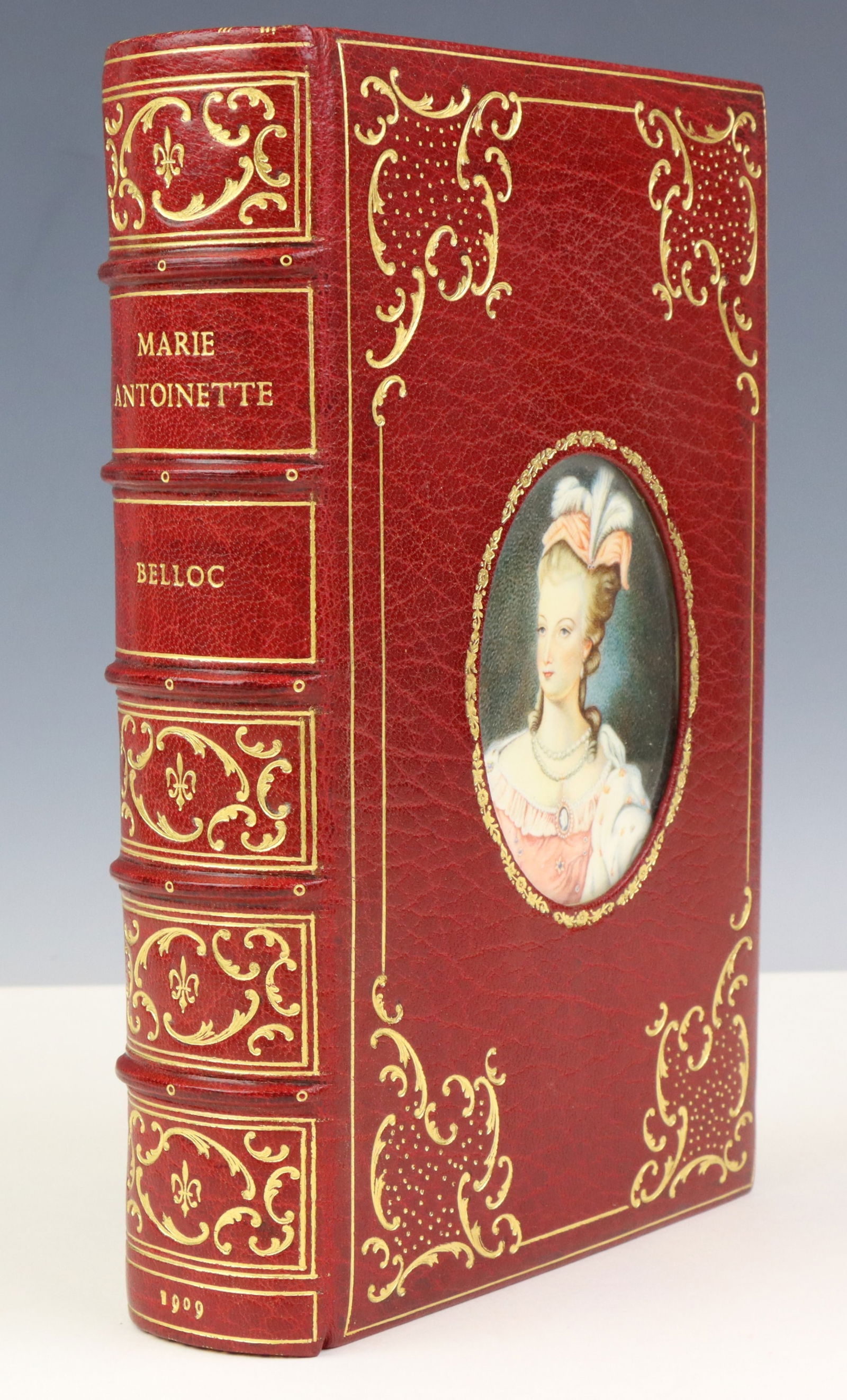 Marie Antoinette-Fine Binding with Miniature: Book titled "Marie Antoinette" by Hilaire Belloc, published by Methuen, London, 1909. Book is octavo in size and presents full red Moroccan binding with gilt decoration. Volume presents inset of minia