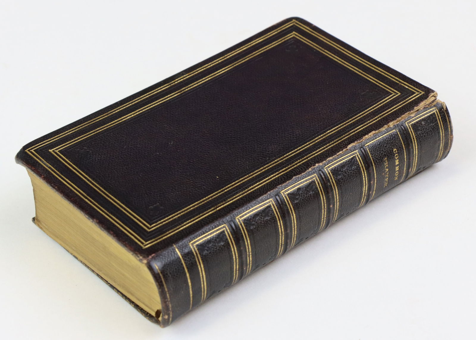 Nineteenth Century Book With Fore-Edge Painting: Book titled "The Book of Common Prayer" printed by University Press, Oxford, 1841. Book is quadragesimo-octavo in size and presents full leather binding . Book presents fore-edge painting of church an